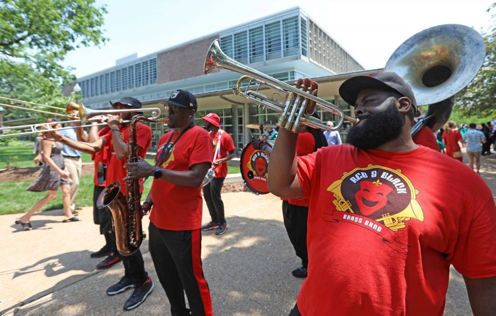 A brass band plays in front of Olin Library.